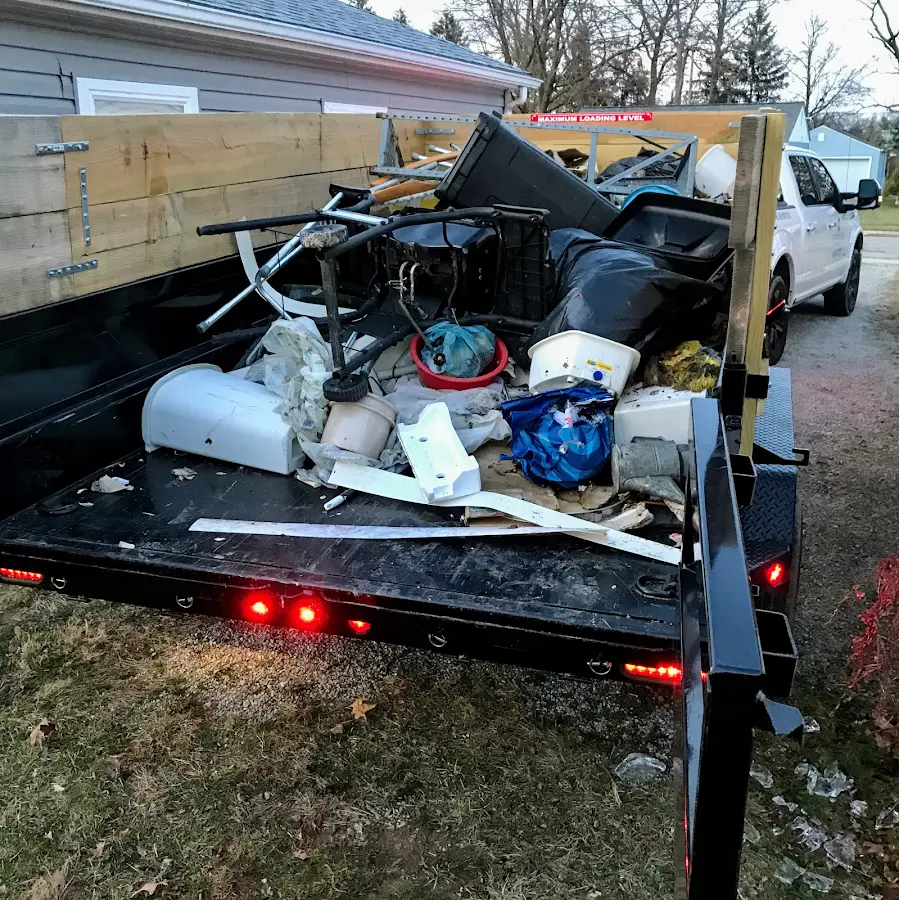 Roll-off dumpster delivered to a residential driveway in Henrietta